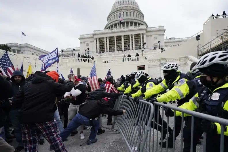 FILE - Violent insurrections loyal to President Donald Trump try to break through a police barrier at the Capitol in Washington on Jan. 6, 2021. Jennifer Leigh Ryan, a real estate agent from suburban Dallas who flaunted her participation in the Jan. 6 riot at the U.S. Capitol on social media and later bragged she wasnt going to jail because she is white, has blond hair and a good job was sentenced on Thursday, Nov. 4, to two months behind bars. (AP Photo/Julio Cortez, File)